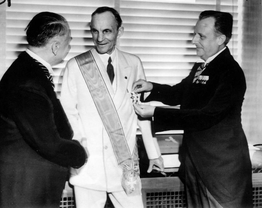 Henry Ford receiving the Grand Cross of the German Eagle from Nazi officials, July 30, 1938. (Courtesy of Getty Images)